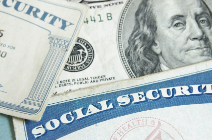 social security cards with dollar bill