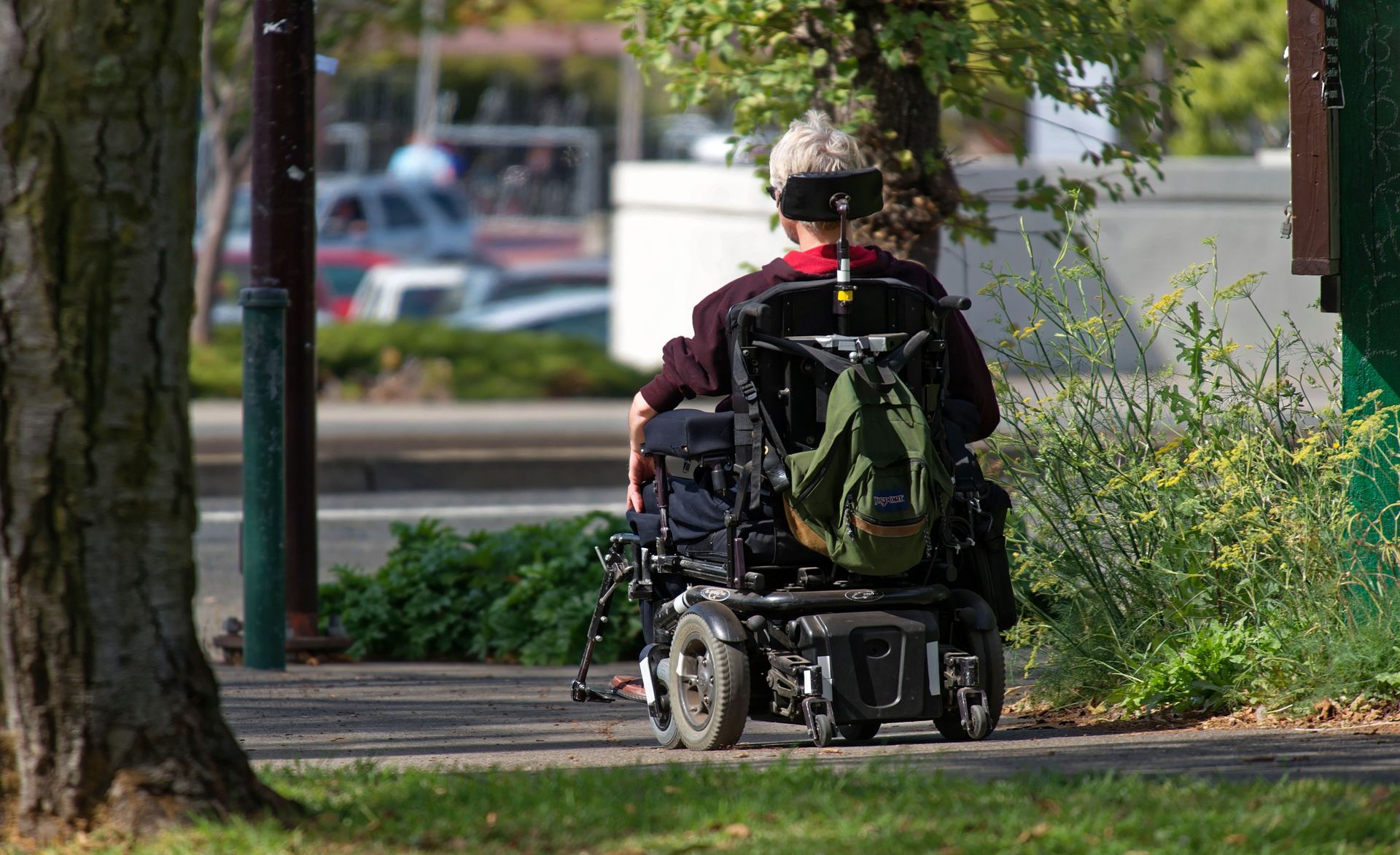 Backview of a senior sitting in a motorized wheelchair